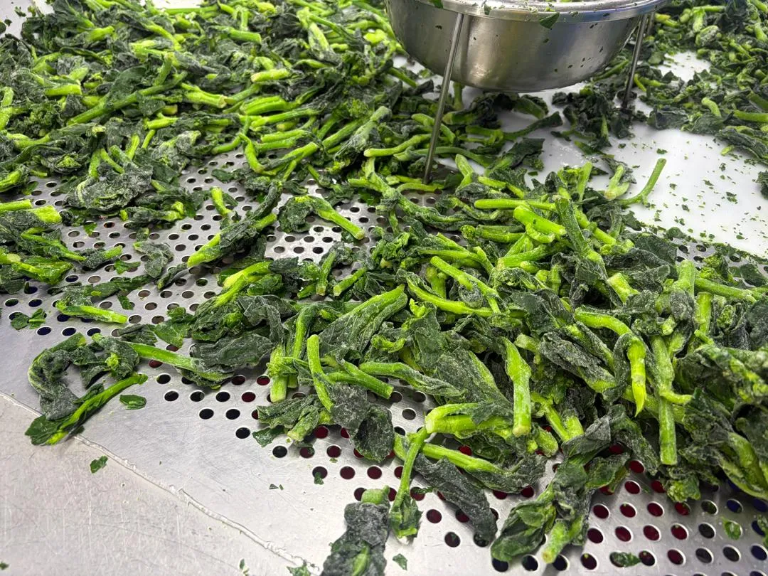 Close-up of prepared green produce.