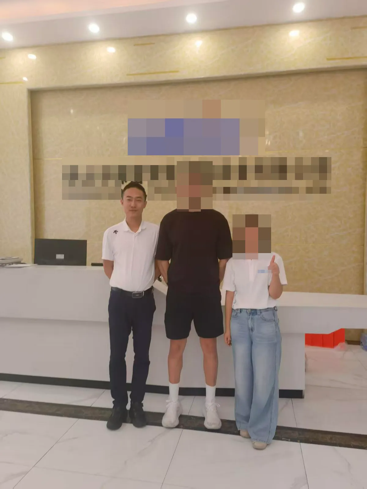 Adrian Liu on a visit; company identification and other faces redacted.